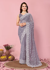 Purple colour party wear saree looking ornate
